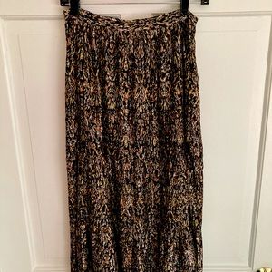 Black and gold-flecked overlay on sheer black skirt